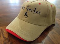 Tan baseball cap on wooden surface